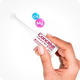 For Conceive Plus Women's Fertility Support and Fertility Lubricant Bundle, a close-up of a single pre-filled fertility lubricant applicator held between fingers, with Ca⁺ and Mg⁺ ion icons floating above to emphasize fertility-supporting ingredients, set against a white background.